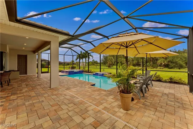 a view of swimming pool with chairs