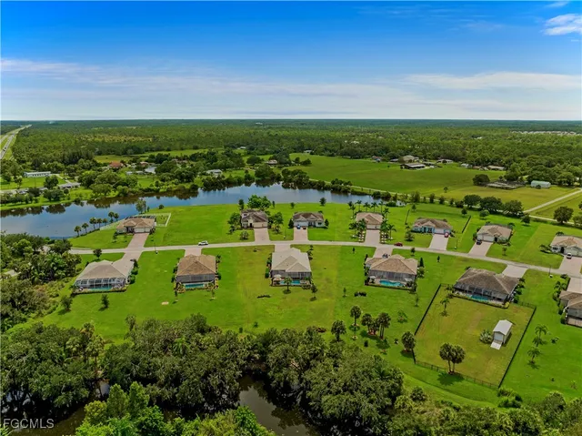 a view of a lake with a yard