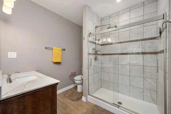 a bathroom with a shower and a sink