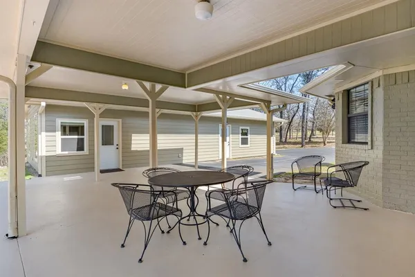 a dining room with furniture and window
