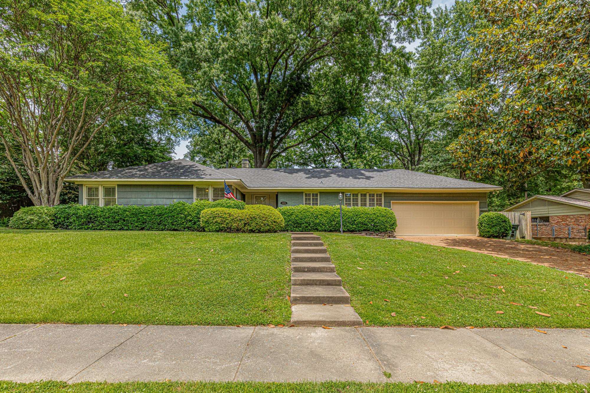front view of a house with a yard