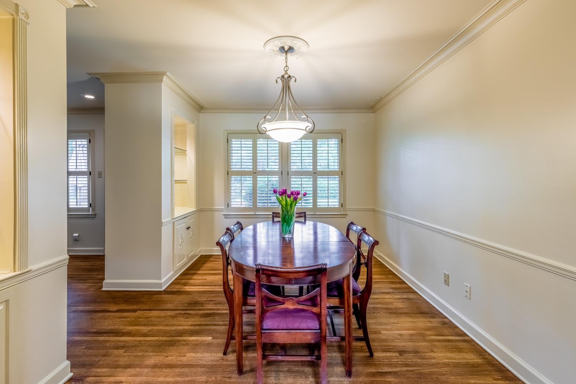 4174 Minden Road Memphis, TN 38117 - Photo 11 of 24 a dining room with furniture a chandelier and wooden floor