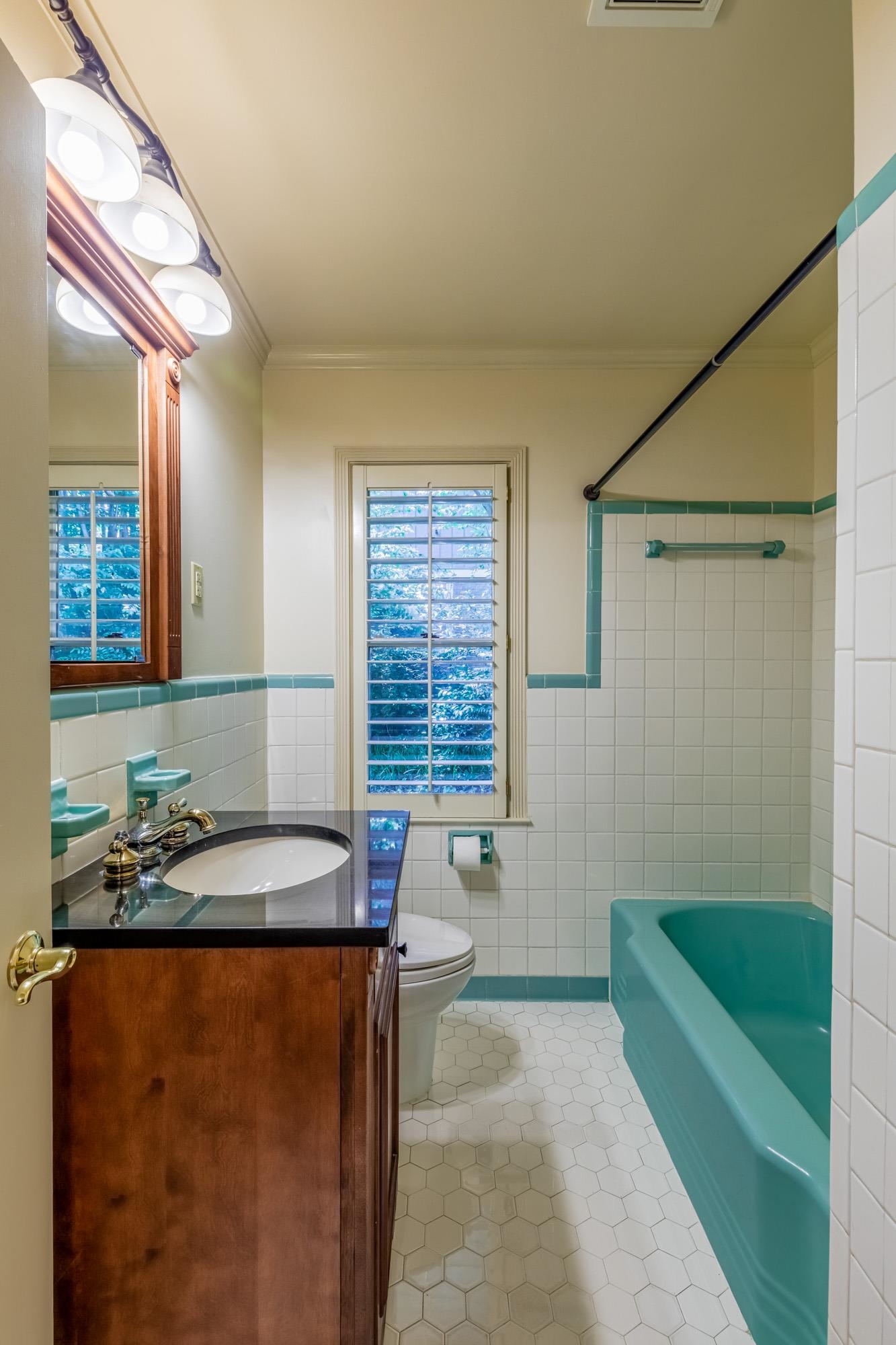 4174 Minden Road Memphis, TN 38117 - Photo 18 of 24 a bathroom with a granite countertop sink and a mirror