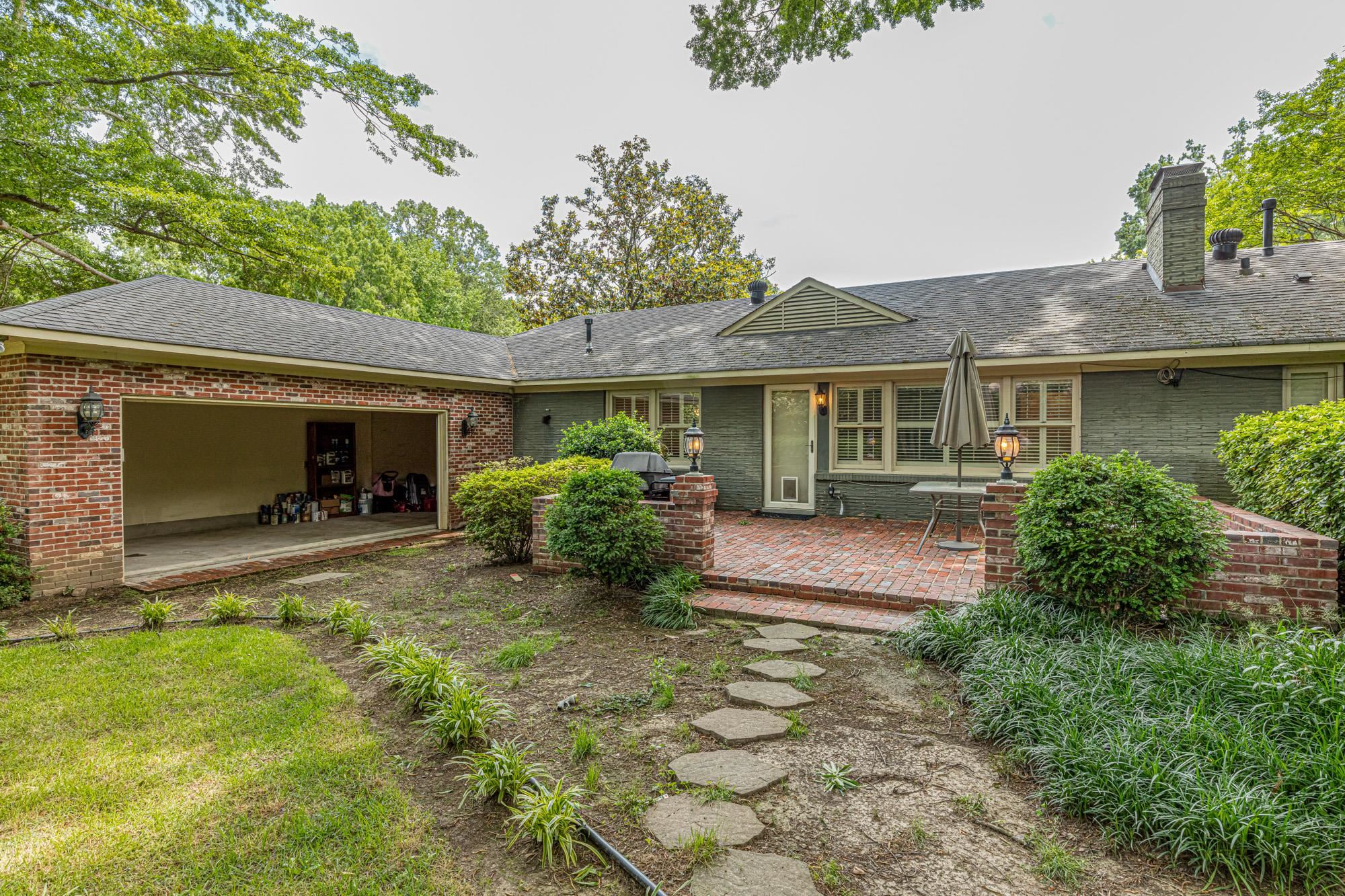 4174 Minden Road Memphis, TN 38117 - Photo 22 of 24 a view of a house with a yard and plants
