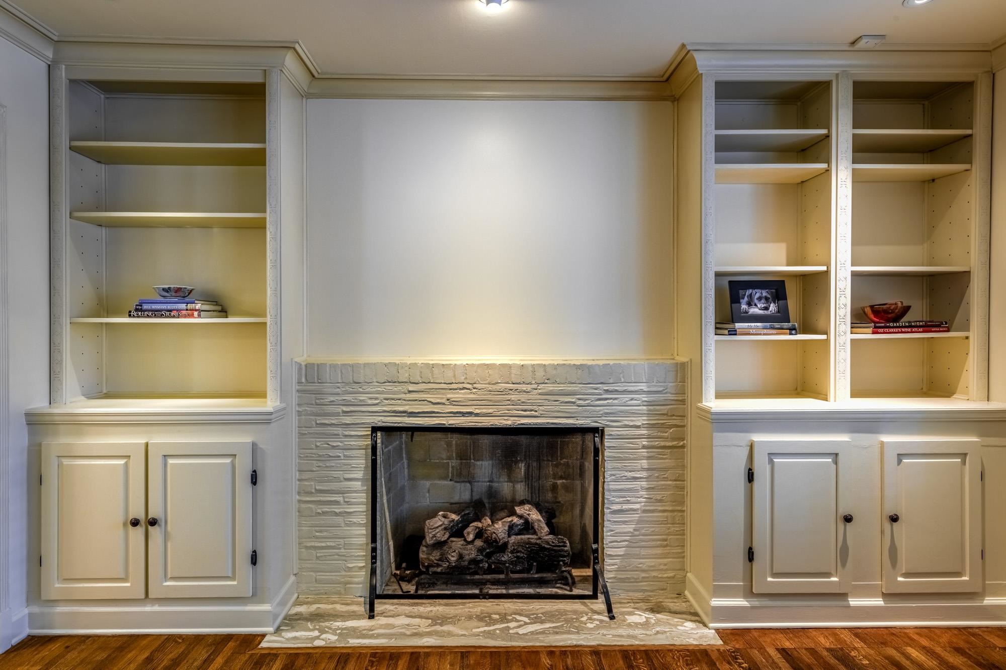 4174 Minden Road Memphis, TN 38117 - Photo 4 of 24 a living room with a fireplace and a walk in closet