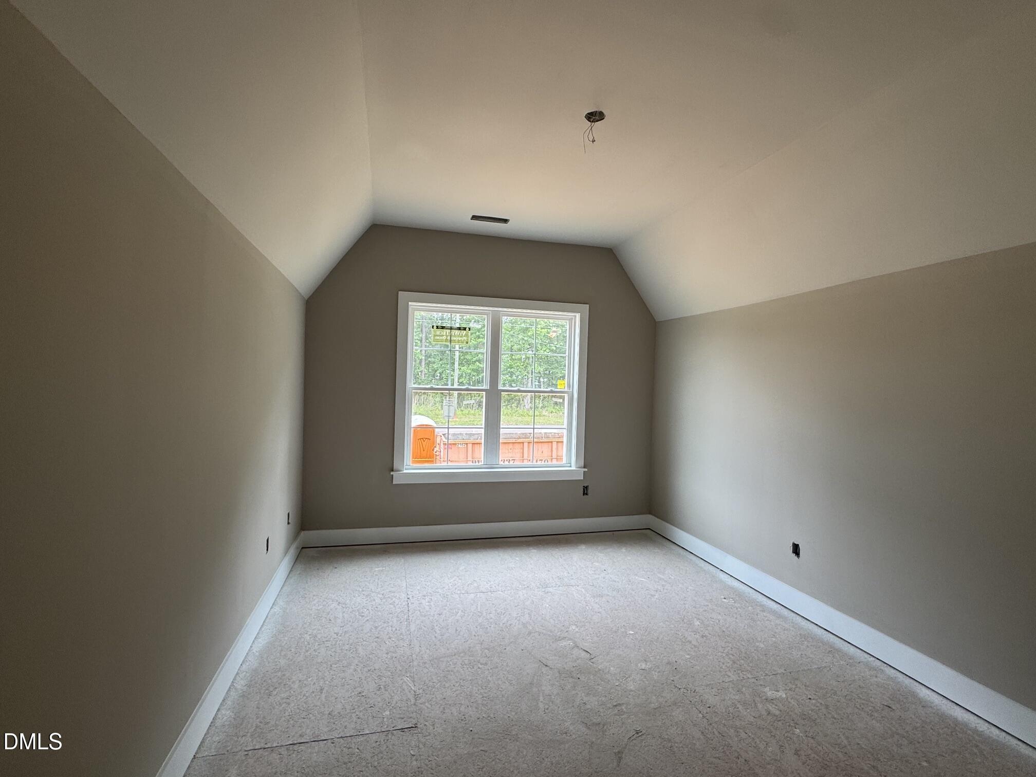 935 Lynch Road Selma, NC 27576 - Photo 17 of 21 an empty room with a window