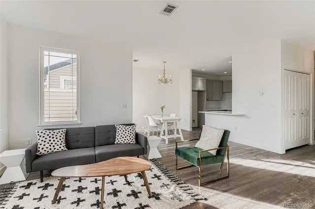 a living room with furniture and a rug