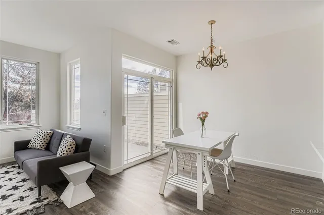 a view of a room with furniture window and wooden floor