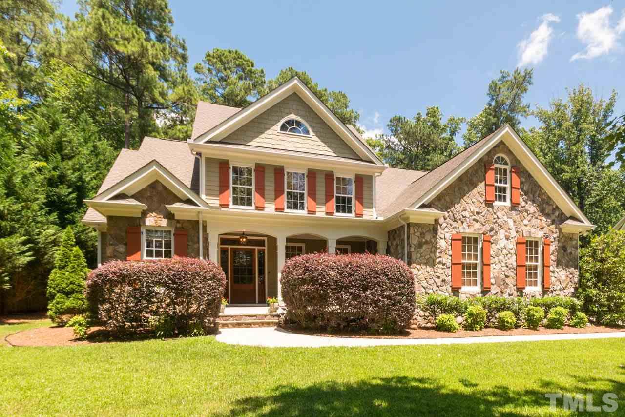 9512 Ray Road Raleigh, NC 27613 - Photo 1 of 25 a front view of a house with a yard
