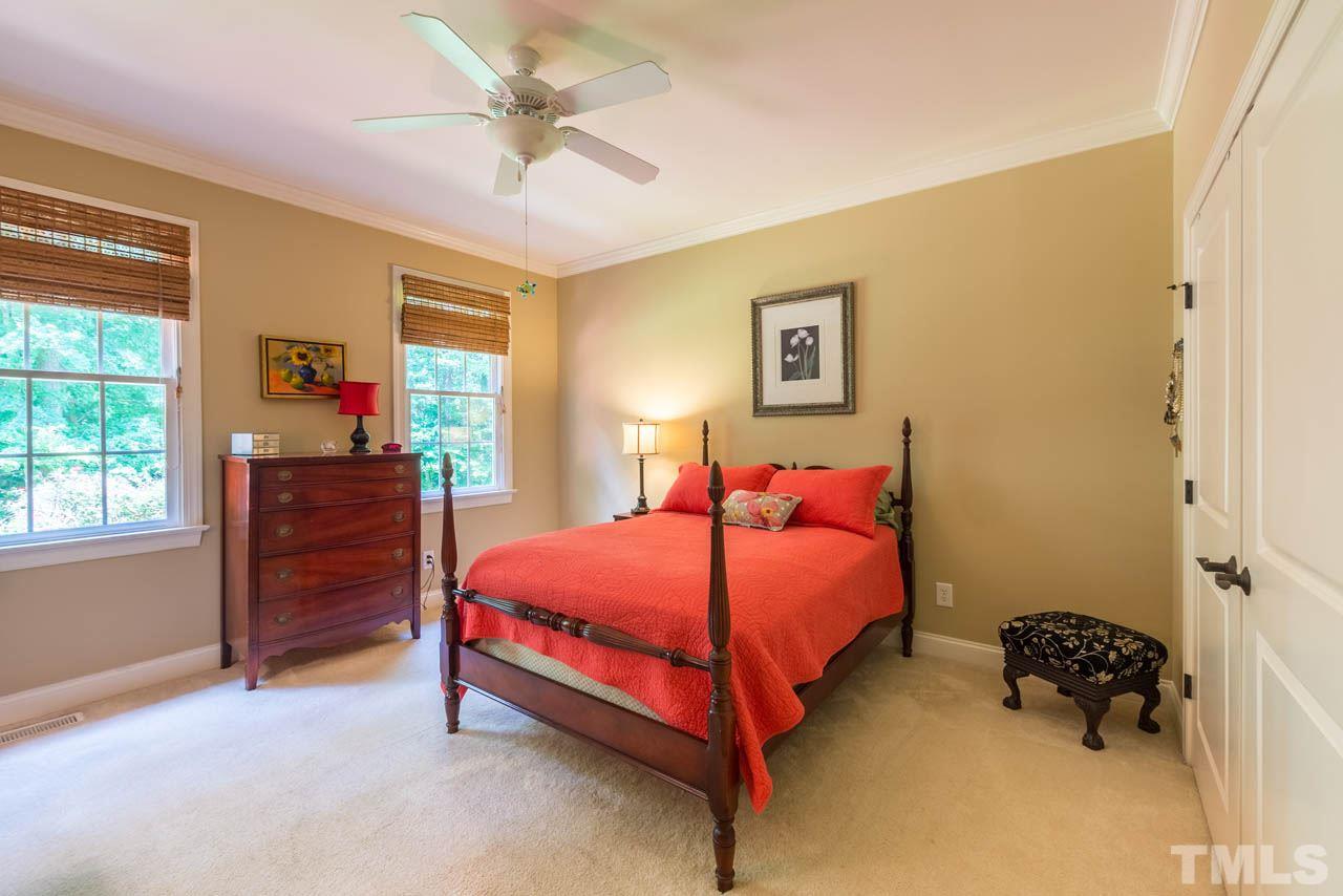 9512 Ray Road Raleigh, NC 27613 - Photo 14 of 25 a bedroom with a bed and a closet
