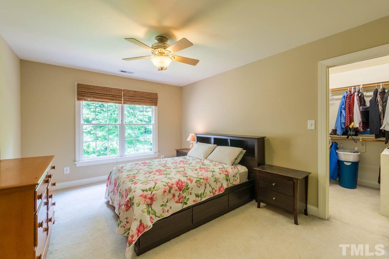 9512 Ray Road Raleigh, NC 27613 - Photo 17 of 25 a bed sitting in a bedroom next to a window