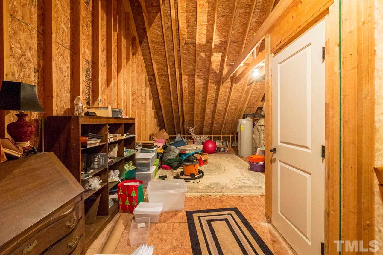 9512 Ray Road Raleigh, NC 27613 - Photo 20 of 25 a very nice looking room with a large window and furniture