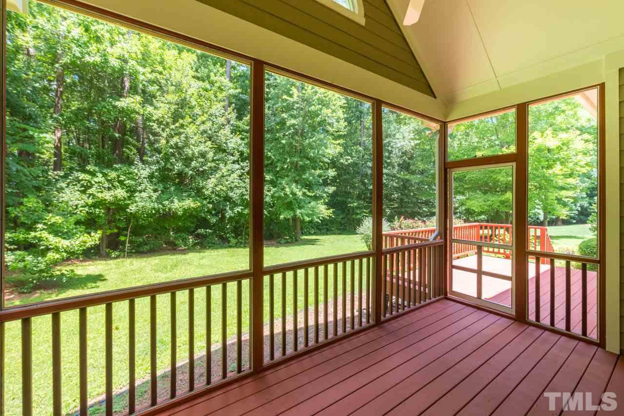 9512 Ray Road Raleigh, NC 27613 - Photo 21 of 25 a view of a porch with wooden floor