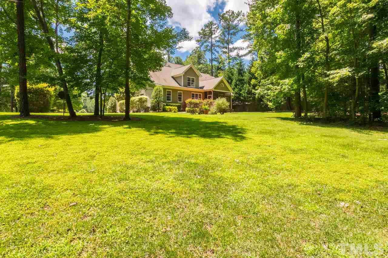 9512 Ray Road Raleigh, NC 27613 - Photo 24 of 25 a view of a swimming pool with an outdoor space and seating area