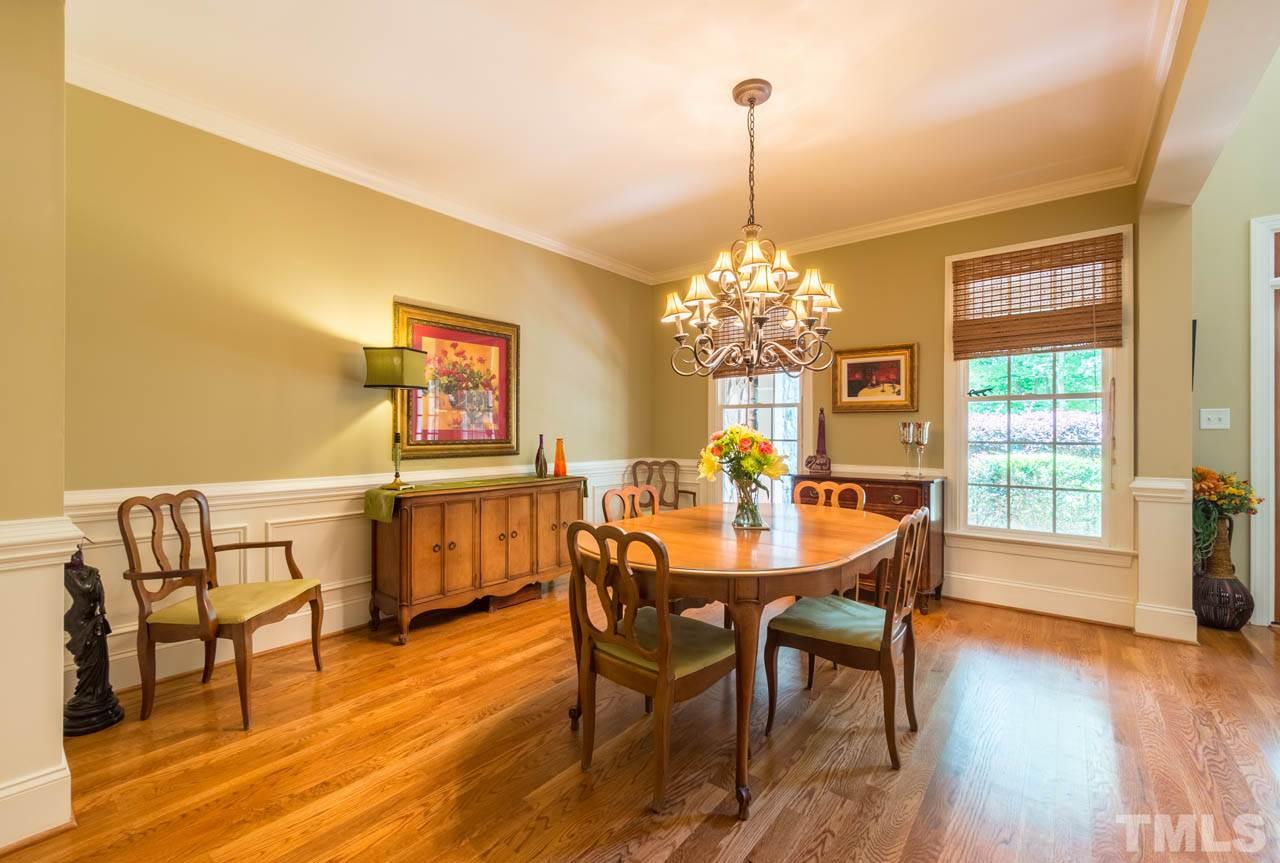9512 Ray Road Raleigh, NC 27613 - Photo 4 of 25 a view of a dining room with furniture window and wooden floor
