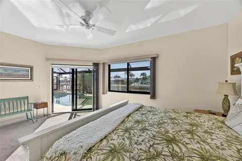 a spacious bathroom with a granite countertop sink a toilet a mirror and bathtub