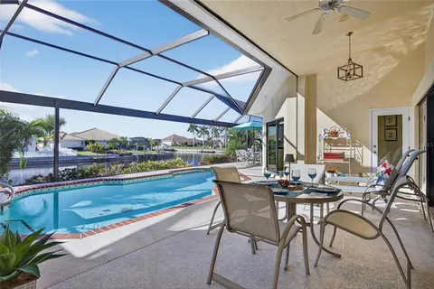 a view of a swimming pool with chairs