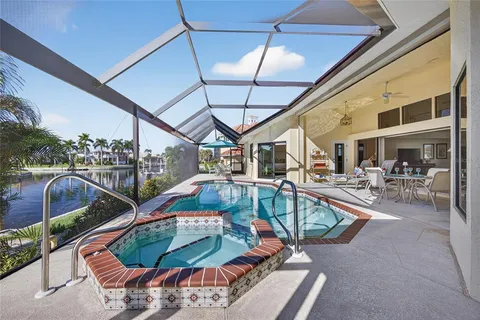 a view of a swimming pool with a patio