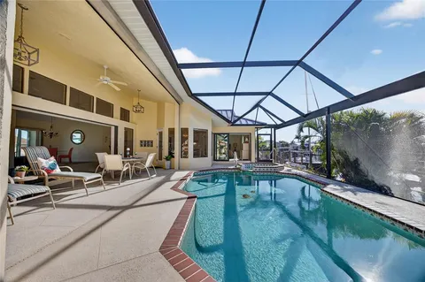 a view of swimming pool with outdoor seating