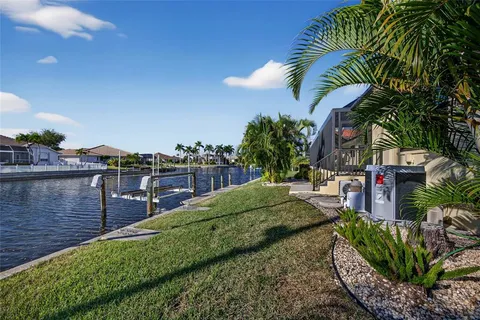 a view of house with outdoor space and swimming pool