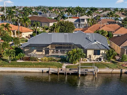 an aerial view of a house with a lake view