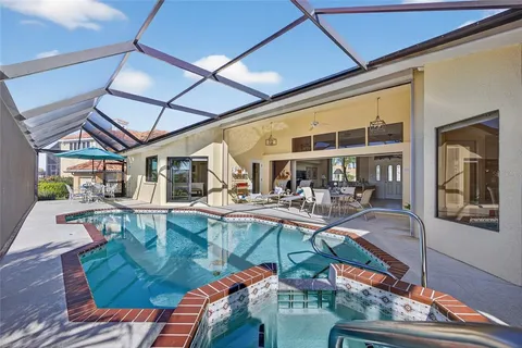 a view of a swimming pool with outdoor seating