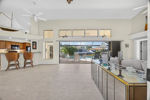 a view of a kitchen with furniture and a large window
