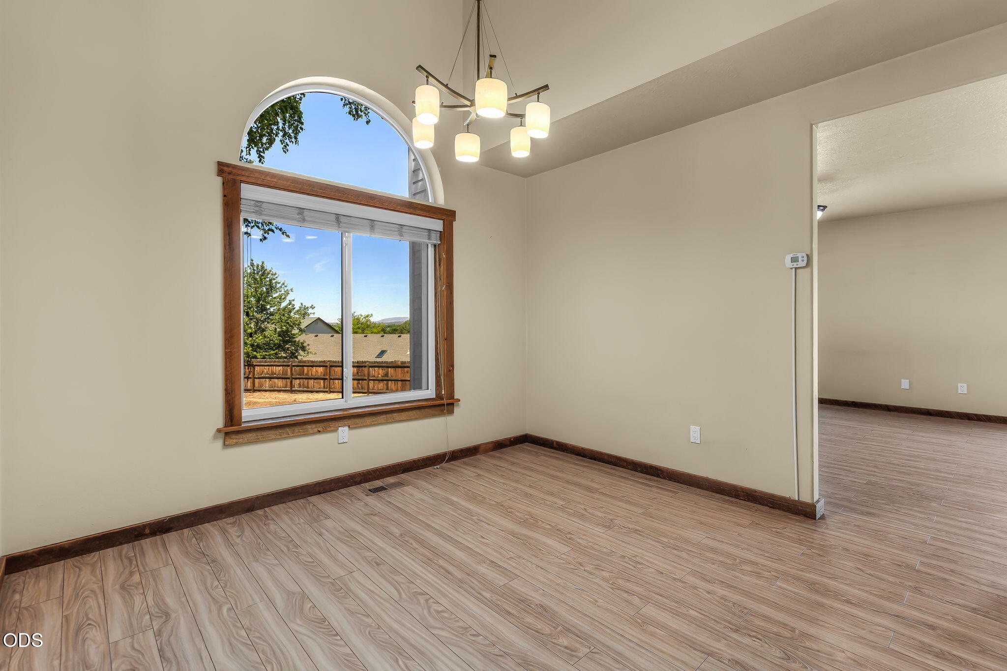 2486 Southwest Valleyview Drive Redmond, OR 97756 - Photo 23 of 55 a view of an empty room with wooden floor and a window
