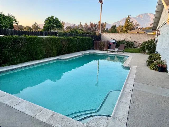 a view of a swimming pool with a lake view