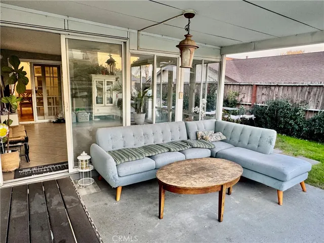 a outdoor living space with furniture and a rug