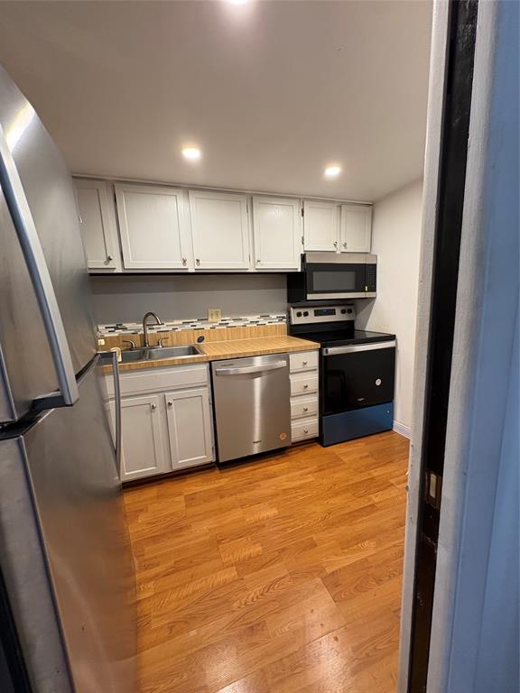 3670 Inverrary Drive, Unit 3B Lauderhill, FL 33319 - Photo 16 of 22 a kitchen with stainless steel appliances granite countertop a stove sink and cabinets