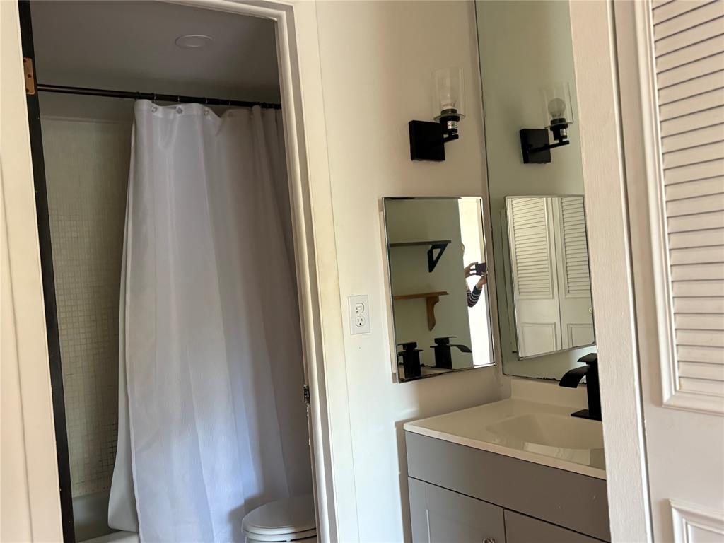 3670 Inverrary Drive, Unit 3B Lauderhill, FL 33319 - Photo 18 of 22 a bathroom with a sink and mirror
