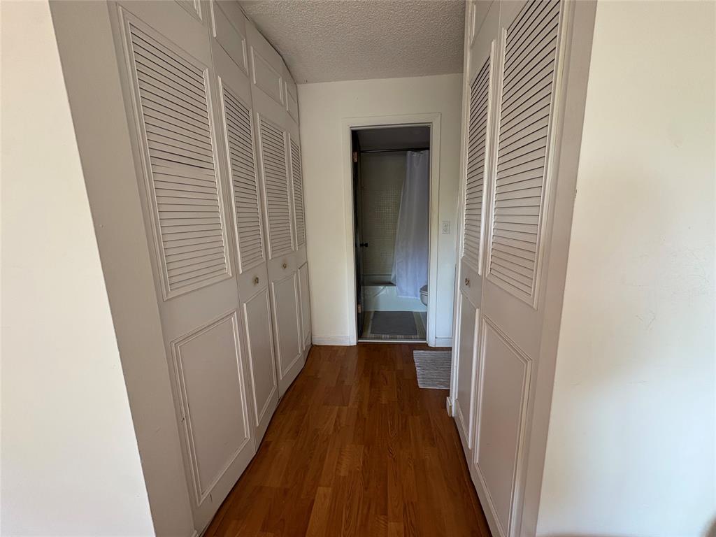 3670 Inverrary Drive, Unit 3B Lauderhill, FL 33319 - Photo 19 of 22 a view of a hallway with wooden floor