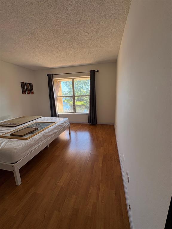 3670 Inverrary Drive, Unit 3B Lauderhill, FL 33319 - Photo 20 of 22 a view of a room with wooden floor and a window