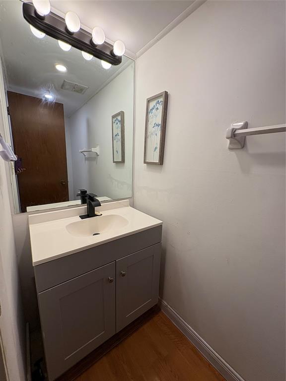 3670 Inverrary Drive, Unit 3B Lauderhill, FL 33319 - Photo 21 of 22 a bathroom with a sink and a mirror