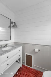 a bathroom with a toilet and a sink