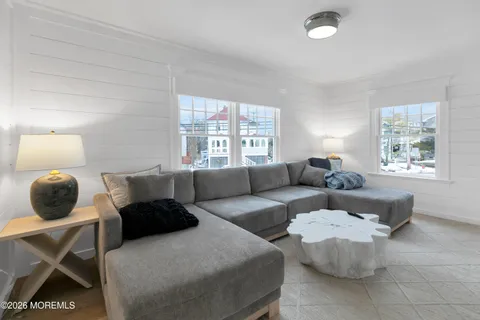 a spacious bedroom with a bed and couch