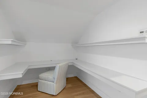 a spacious bedroom with a bed and a couch