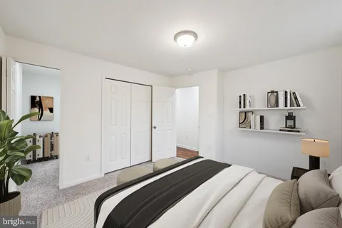 a bedroom with a bed and cabinets