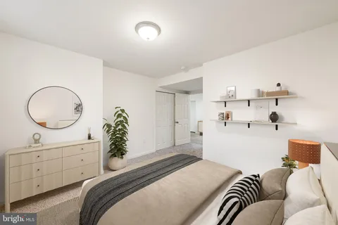 a bedroom with a bed and closet