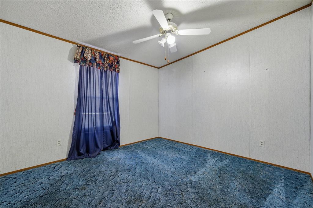 220 North Houston Street Edgewood, TX 75117 - Photo 18 of 30 an empty room with windows