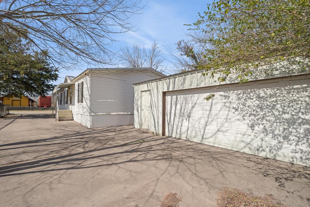220 North Houston Street Edgewood, TX 75117 - Photo 2 of 30 a view of a house with a outdoor space