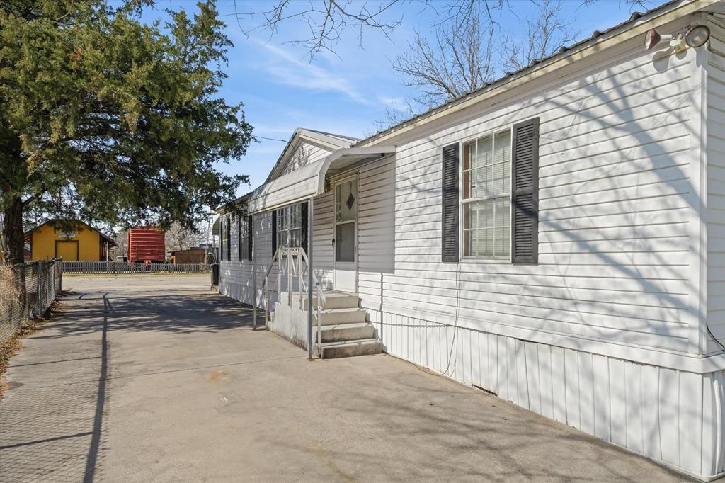 220 North Houston Street Edgewood, TX 75117 - Photo 23 of 30 a view of a house with a small yard