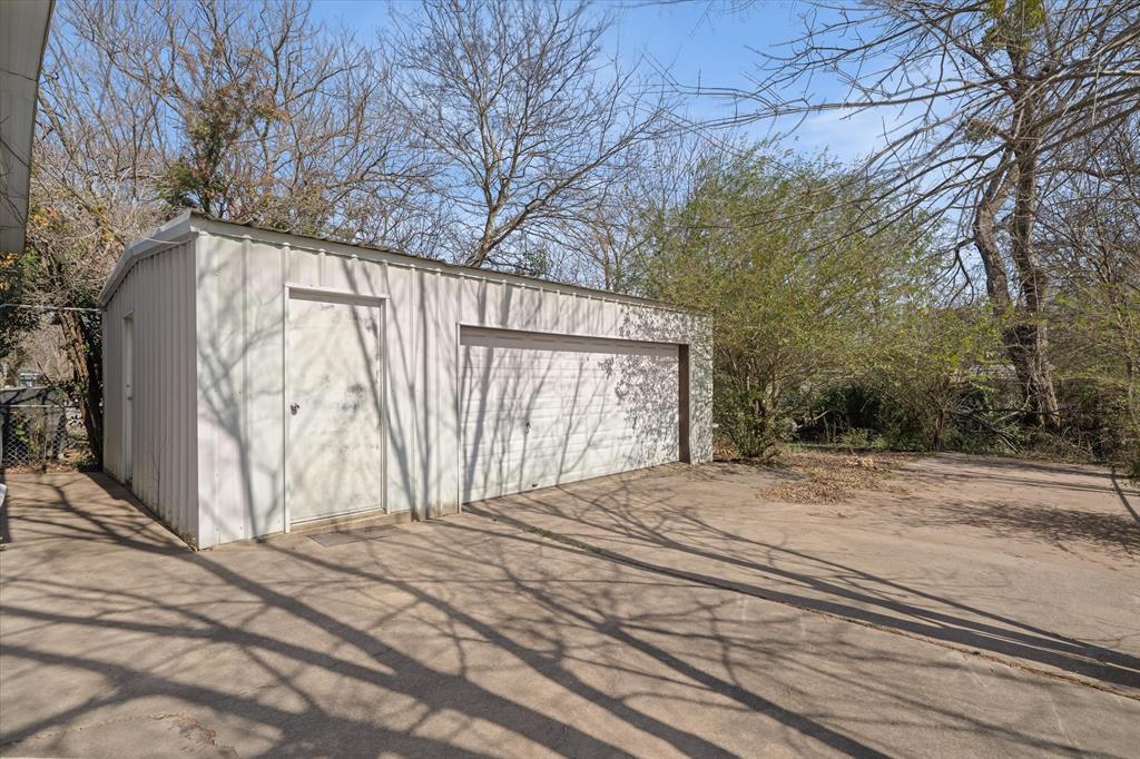 220 North Houston Street Edgewood, TX 75117 - Photo 26 of 30 a view of a backyard of the house