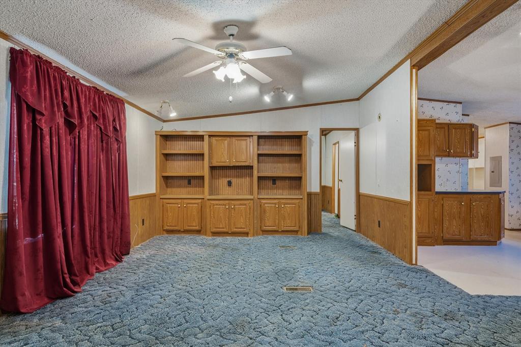 220 North Houston Street Edgewood, TX 75117 - Photo 5 of 30 a view of a bedroom with furniture and natural light