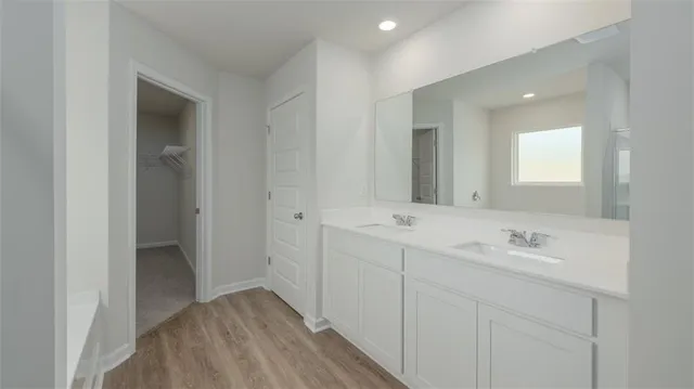 a en suite bathroom with a bathtub and window