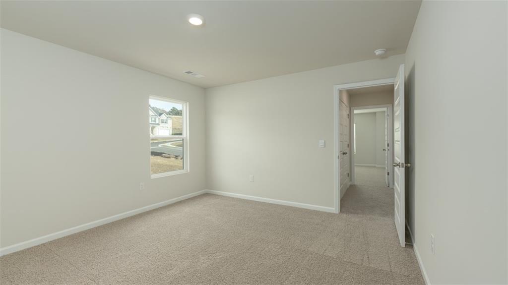 1949 Van Alen Court Dacula, GA 30019 - Photo 43 of 46 an empty room with windows and closet