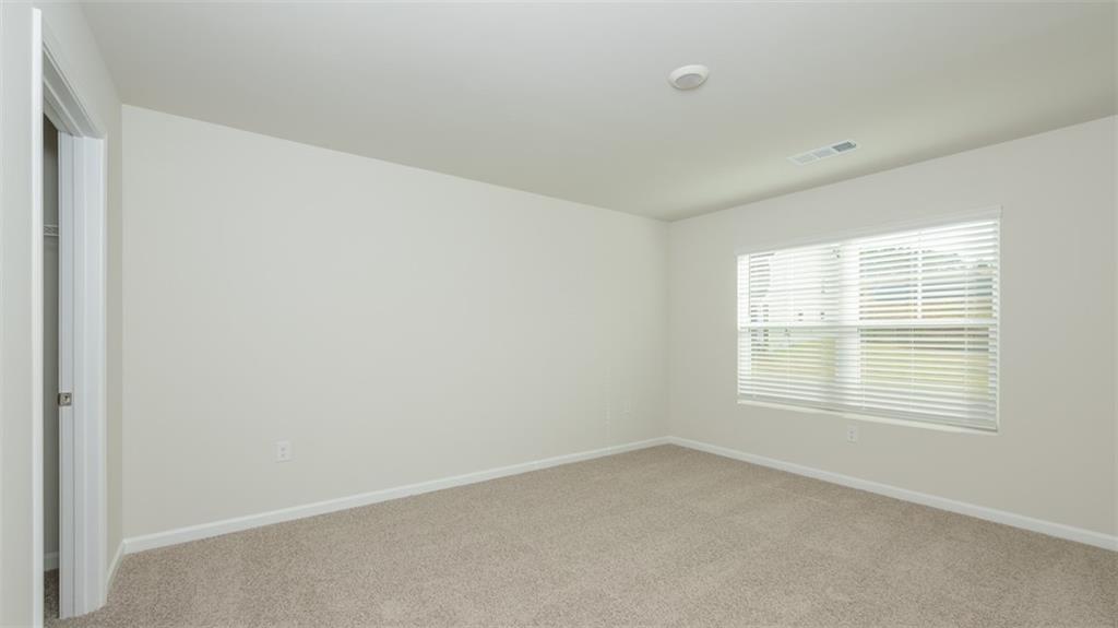 1949 Van Alen Court Dacula, GA 30019 - Photo 44 of 46 an empty room with a window
