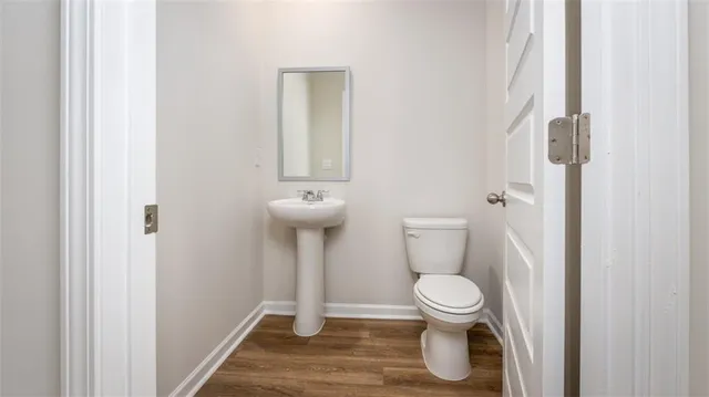 a bathroom with a toilet and a sink