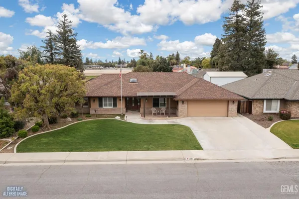 a view of a house with a garden